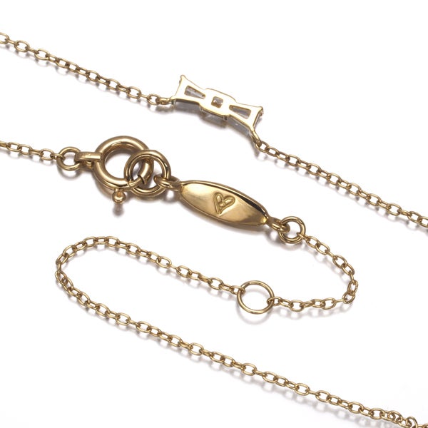 アーカー ネックレス ダイヤ 0.08ct  リボン K18YG 